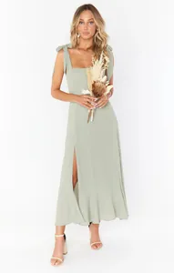 Elegant sage green summer midi dress with tie-up straps and high side slit detail
