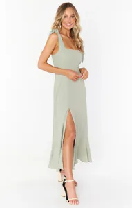 Elegant sage green midi dress with tie-shoulder straps and high side slit detail