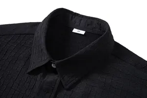 Close-up detail of black men's casual short sleeve shirt collar with jacquard texture
