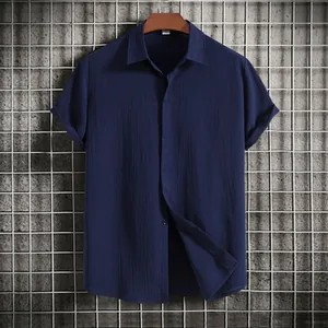 Detail showing the rich texture and navy color of this loose men's short sleeve shirt