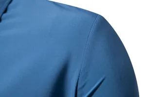 Detailed macro view of blue fabric texture and shoulder seam on men's casual shirt