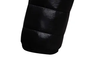 Close-up detail of a men's lightweight black quilted puffer jacket with glossy finish