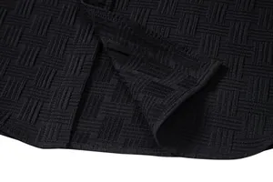 Close-up of black textured weave fabric for men's ethnic style short sleeve shirt