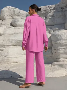 Back view of women's hot pink two-piece casual set featuring long-sleeve shirt and trousers