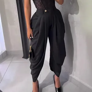 Elegant black high-waisted pleated tulip pants for urban chic and sophisticated style