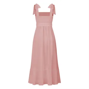 Back view of pink French midi dress showing smocked bodice and tied straps