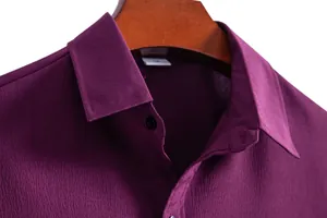 Close-up of men's purple shirt showing collar and textured fabric detail