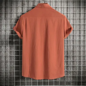 Detailed back view of a men's rust orange short-sleeve casual shirt with linen texture