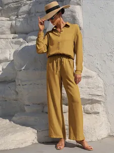 Mustard yellow long-sleeved two-piece set with button-down shirt and wide-leg trousers