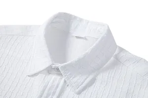 Detailed close-up of a white men's casual shirt featuring unique bubble jacquard texture
