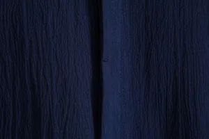 Detailed view showing the premium navy blue seersucker fabric texture of men's summer shirt