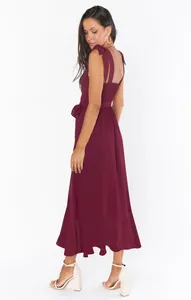 Back view of a chic maroon maxi dress with tie-straps and smocked detail for summer
