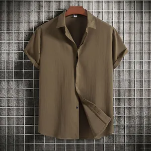 Detail of men's casual olive green short sleeve button down shirt with textured fabric