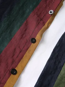 Macro detail of breathable cotton linen men's shirt featuring colorful vertical block stripes