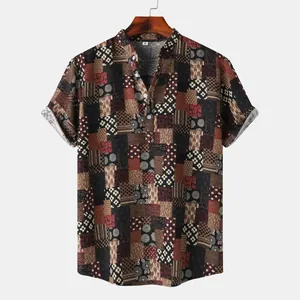 Detailed view of men's short sleeve shirt featuring vintage patchwork print pattern