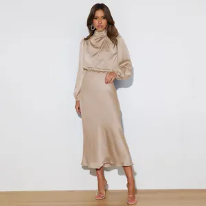 Elegant champagne satin long sleeve evening dress with high neck and cinched waist