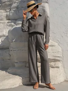 Elegant dark grey two-piece set with long sleeve shirt and matching wide leg lounge pants.