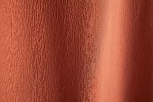Macro view showing the breathable textured fabric of men's casual solid color shirt.