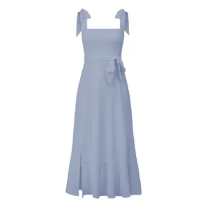 Detailed view of an elegant light blue midi dress with tie-shoulder straps and waist tie.
