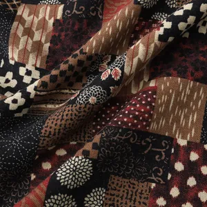 Close-up of retro patchwork pattern on men's casual Hawaiian short sleeve shirt fabric.