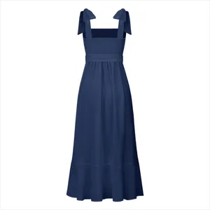 Back view of navy blue maxi dress with bow shoulder straps and smocked bodice