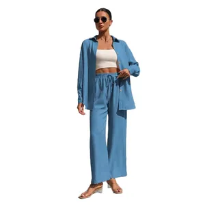 Elegant blue two-piece casual set with long-sleeve button-up shirt and wide-leg pants