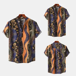 Detailed view of men's short-sleeve Hawaiian shirt with wave and floral prints