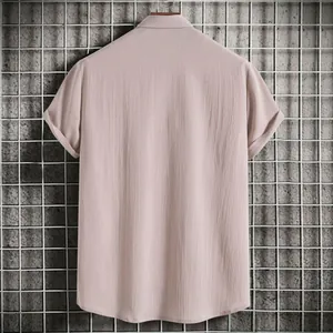 Back view of a men's loose short-sleeved shirt in dusty rose with textured linen fabric