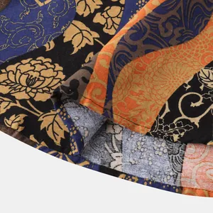 Macro detail of men's Hawaiian shirt fabric showing vintage floral pattern and stitching