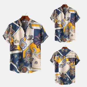 Detail view of men's short-sleeved shirt with vintage paisley print and mandarin collar.