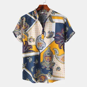 Detail view of men's summer short sleeve shirt with vibrant paisley and geometric print