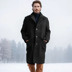 Elegant charcoal single-breasted long woolen overcoat for men in snowy outdoor setting