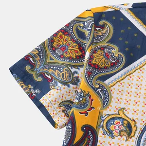 Close-up detail of vibrant paisley pattern on Hawaiian style men's short sleeve shirt
