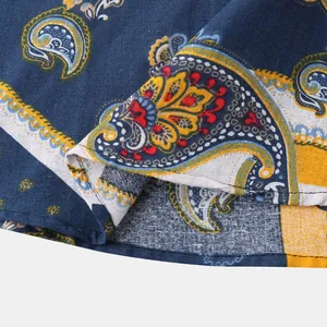 Detailed close-up showing the intricate paisley print and fabric texture of a men's shirt