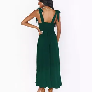 Elegant dark green midi dress with bow shoulder straps and a smocked back detail
