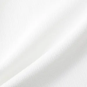 Close-up detail of breathable white honeycomb mesh fabric for men's casual shirts.
