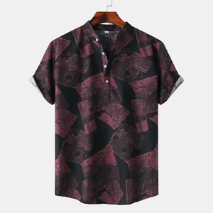 Detailed view of men's short-sleeve shirt featuring a vintage dark red newspaper print
