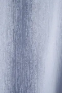 Macro view of breathable light blue textured fabric for 2025 summer men's casual short-sleeved shirt