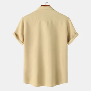 Macro view of the back of a men's textured short sleeve casual shirt in khaki color