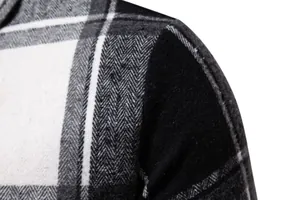 Primer plano de la tela de camisa de franela a cuadros blancos y negros gruesos.