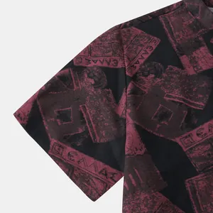 Close-up of men's casual shirt sleeve with vintage burgundy stamp print on black fabric