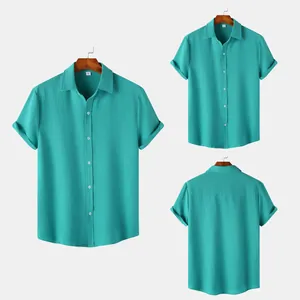 Detail view of men's teal short sleeve shirt showing front and back textured fabric