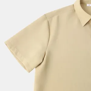 Close-up detail of beige waffle knit texture on men's short sleeve shirt