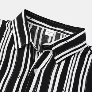 Detail view of striped men's casual shirt lapel collar with size M neck label