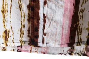 Detailed view of the abstract stripe print and quality stitching on men's casual shirt