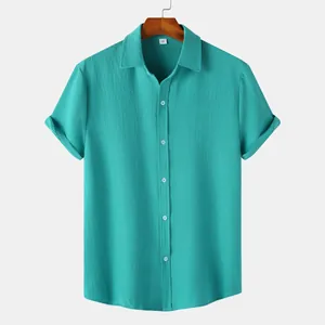 Detailed texture of men's short-sleeve teal shirt with crinkled fabric and buttons