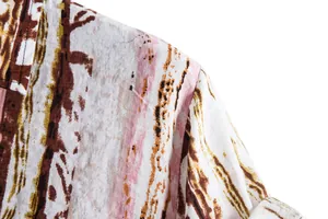 Close-up detail of the fabric texture and print on a men's floral casual shirt