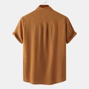 Back view of a mustard yellow cotton linen short sleeve shirt with mandarin collar