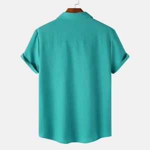 Back view of a teal men's short-sleeve shirt with fine textured fabric and clean seams.