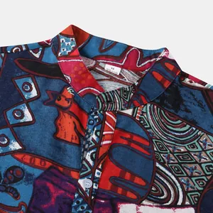 Detail of men's Hawaiian shirt collar with colorful ethnic print and fabric texture.